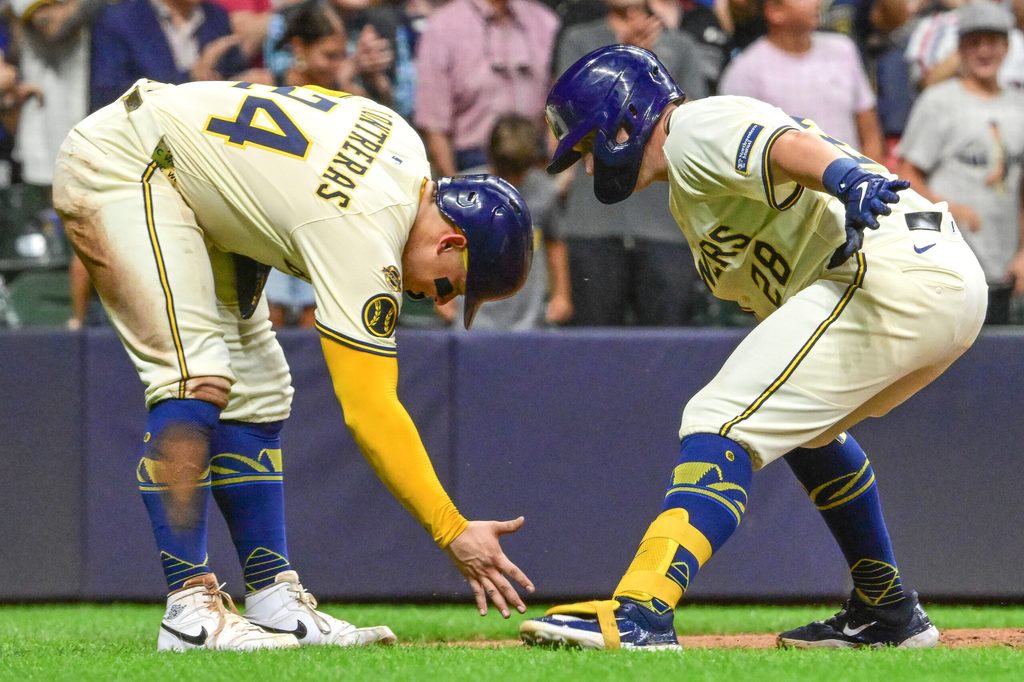 Aug 12, 2025; Milwaukee, Wisconsin, USA; Milwaukee Brewers first baseman Andrew Vaughn (28) celebrates with catcher William Contreras (24) after hitting a three run home run in the sixth inning at American Family Field. Mandatory Credit: Benny Sieu-Imagn Images