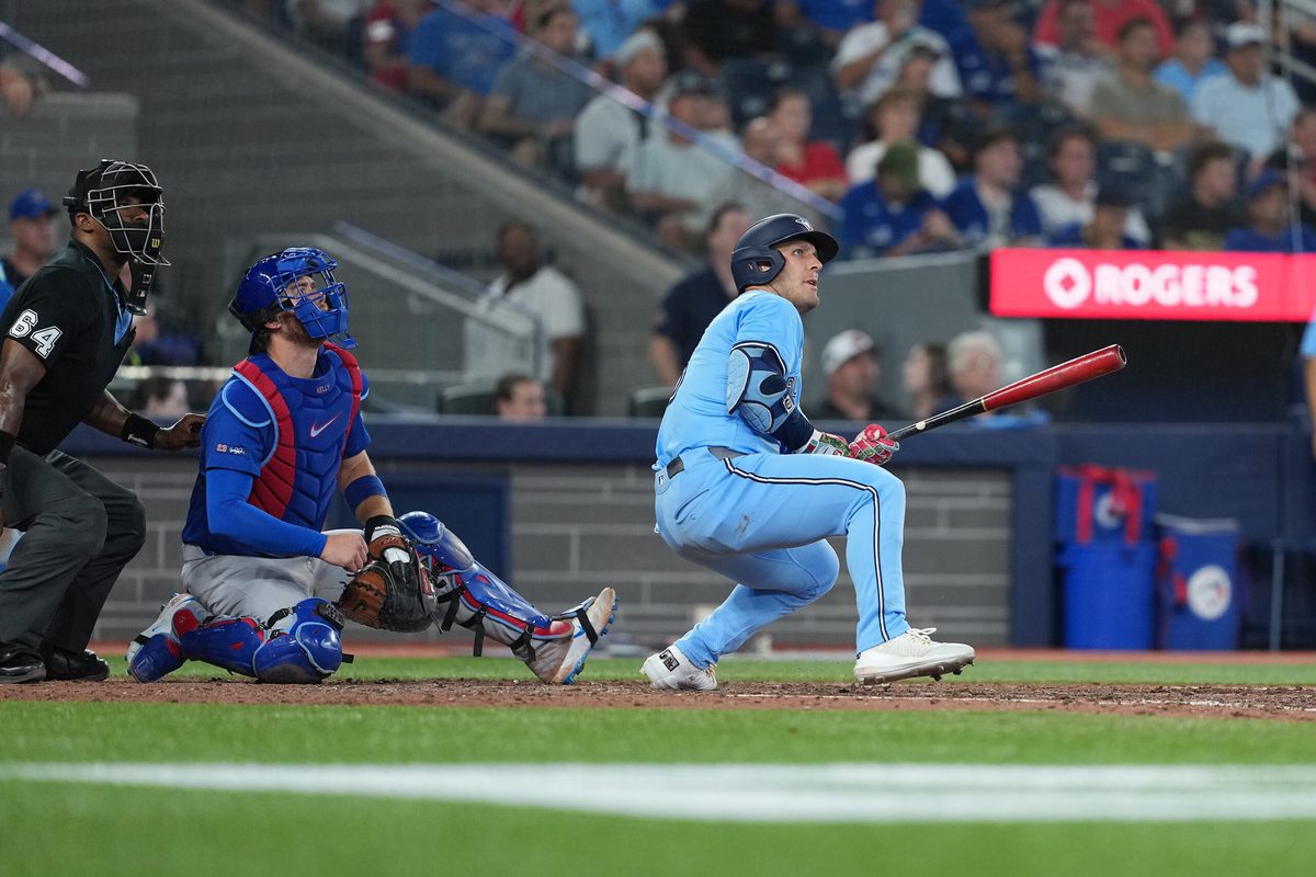 Aug 12, 2025; Toronto, Ontario, CAN; Toronto Blue Jays centre fielder Daulton Varsho (5) reacts after hitting a home run against the Chicago Cubs during the eighth inning at Rogers Centre. Mandatory Credit: Nick Turchiaro-Imagn Images