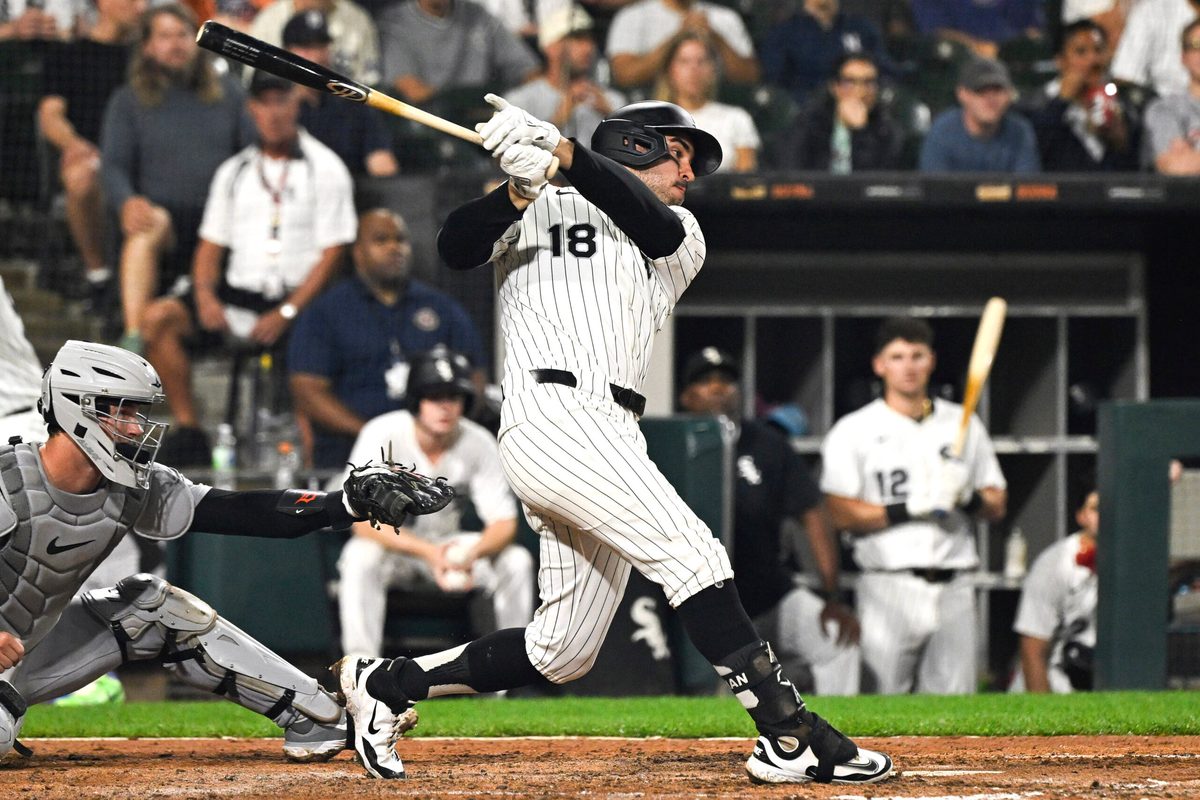 Aug 12, 2025; Chicago, Illinois, USA; Chicago White Sox outfielder Mike Tauchman (18) hits a single against the Detroit Tigers during the fifth inning at Rate Field. Mandatory Credit: Matt Marton-Imagn Images