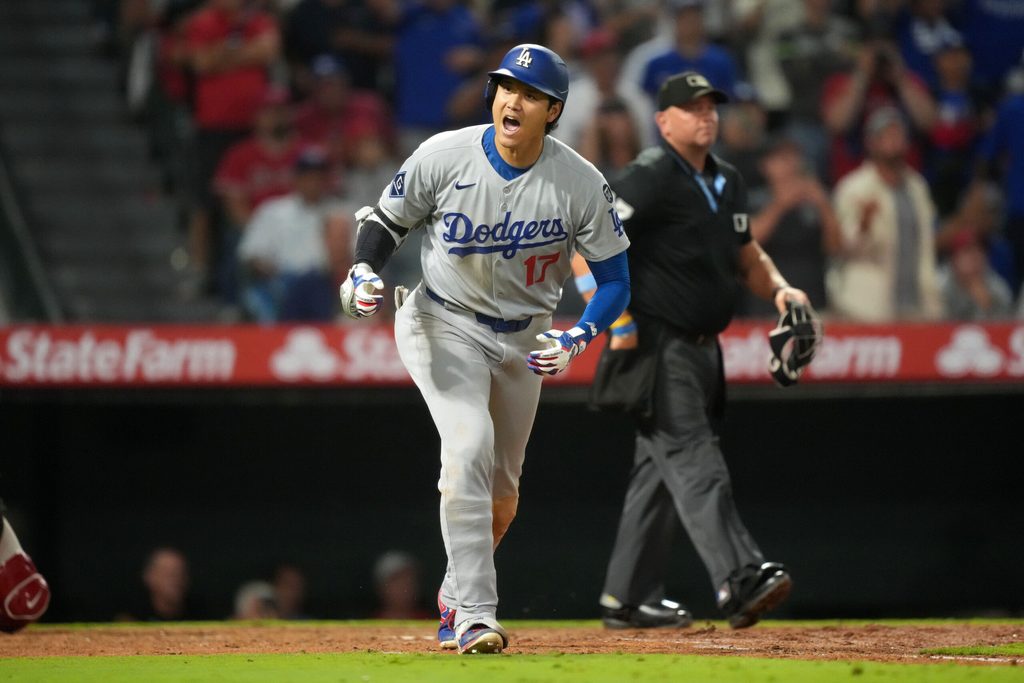 Aug 12, 2025; Anaheim, California, USA; Los Angeles Dodgers designated hitter Shohei Ohtani (17) reacts after hitting a home run in the ninth inning against the Los Angeles Angels at Angel Stadium. Mandatory Credit: Kirby Lee-Imagn Images