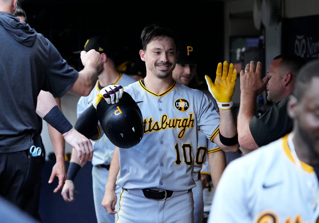 Aug 13, 2025; Milwaukee, Wisconsin, USA; Pittsburgh Pirates outfielder Bryan Reynolds (10) celebrates in the dugout after hitting a home run against the Milwaukee Brewers in the sixth inning at American Family Field. Mandatory Credit: Michael McLoone-Imagn Images