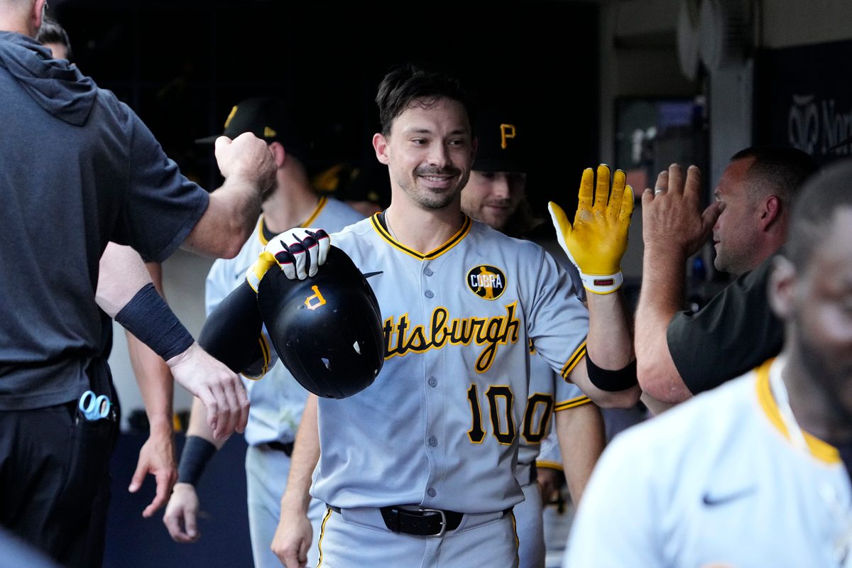 Aug 13, 2025; Milwaukee, Wisconsin, USA; Pittsburgh Pirates outfielder Bryan Reynolds (10) celebrates in the dugout after hitting a home run against the Milwaukee Brewers in the sixth inning at American Family Field. Mandatory Credit: Michael McLoone-Imagn Images