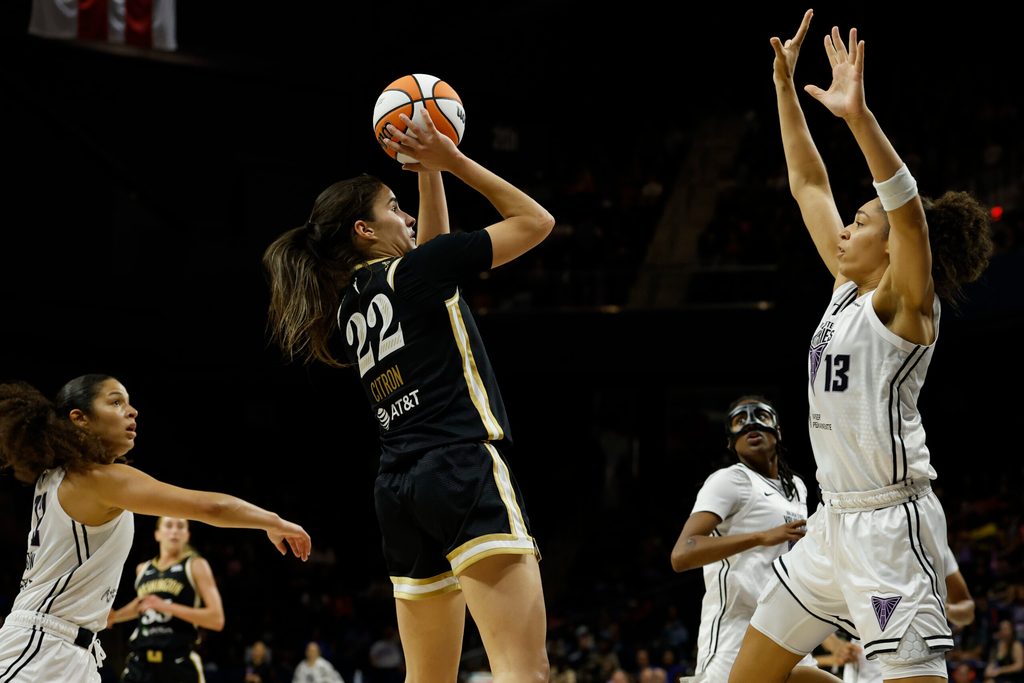 Aug 13, 2025; Washington, District of Columbia, USA; Washington Mystics guard Sonia Citron (22) is fouled while scoring by Golden State Valkyries forward Janelle Salaun (13) as Valkyries guard Veronica Burton (22) defends in the second half at CareFirst Arena. Mandatory Credit: Geoff Burke-Imagn Images