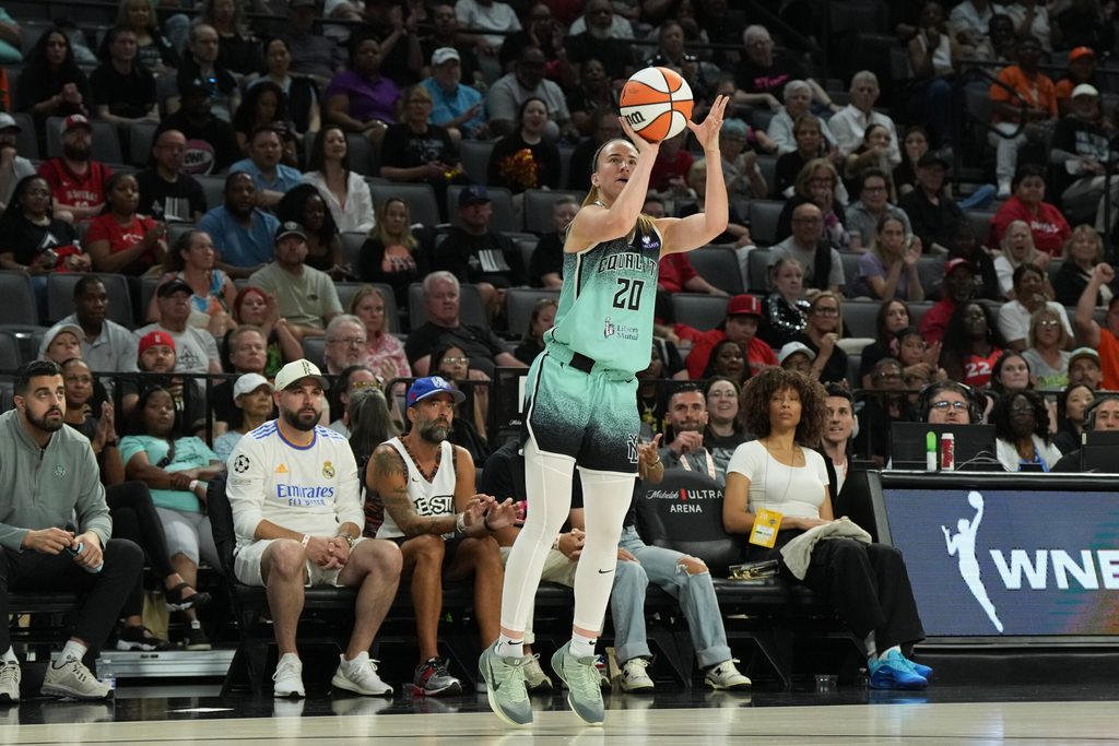 Aug 13, 2025; Las Vegas, Nevada, USA; New York Liberty guard Sabrina Ionescu (20) shoots a 3-pointer against the Las Vegas Aces during the fourth quarter of their game at Michelob Ultra Arena. Mandatory Credit: Candice Ward-Imagn Images