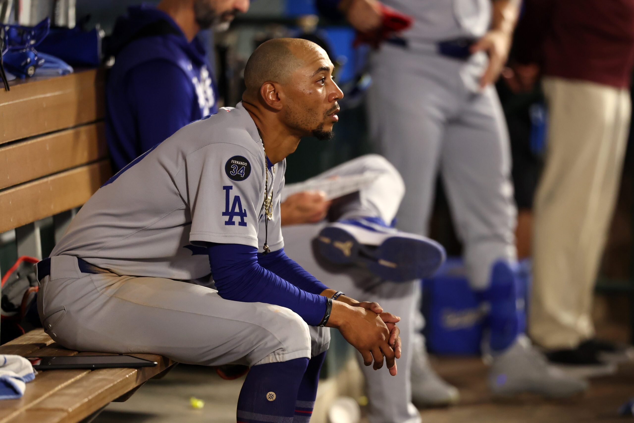 Aug 13, 2025; Anaheim, California, USA; Los Angeles Dodgers shortstop Mookie Betts (50) looks on in the dugout during the ninth inning against the Los Angeles Angels at Angel Stadium. Mandatory Credit: Kiyoshi Mio-Imagn Images