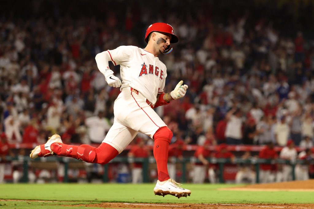 Aug 13, 2025; Anaheim, California, USA; Los Angeles Angels shortstop Zach Neto (9) hits an RBI double during the fifth inning against the Los Angeles Dodgers at Angel Stadium. Mandatory Credit: Kiyoshi Mio-Imagn Images
