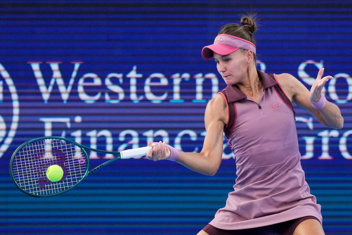 Aug 14, 2025; Cincinnati, OH, USA; Veronika Kudermetova (RUS) returns a shot against Magda Linette (POL) during the Cincinnati Open at the Lindner Family Tennis Center. Mandatory Credit: Aaron Doster-Imagn Images