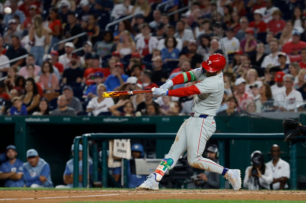 Aug 15, 2025; Washington, District of Columbia, USA; Philadelphia Phillies first baseman Bryce Harper (3) hits a solo home run against the Washington Nationals during the seventh inning at Nationals Park. Mandatory Credit: Geoff Burke-Imagn Images