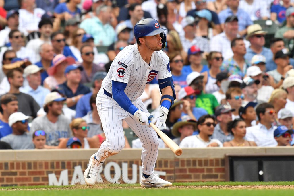 Aug 16, 2025; Chicago, Illinois, USA; Chicago Cubs second baseman Nico Hoerner (2) hits an RBI double during the eighth inning against the Pittsburgh Pirates at Wrigley Field. Mandatory Credit: Patrick Gorski-Imagn Images