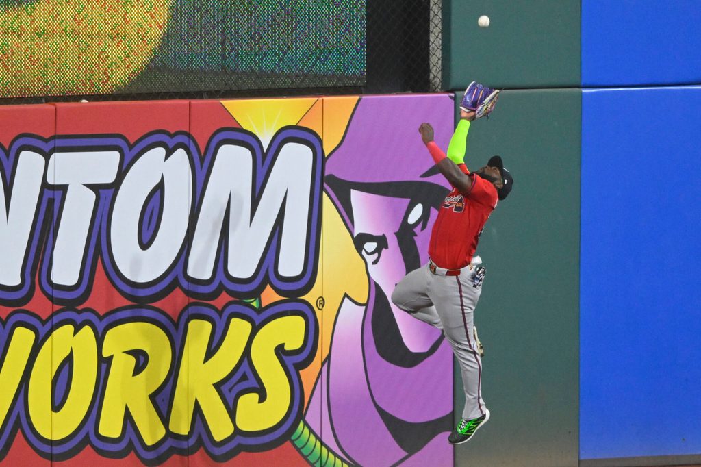Aug 16, 2025; Cleveland, Ohio, USA; Atlanta Braves center fielder Michael Harris II (23) makes a catch at the wall in the ninth inning against the Cleveland Guardians at Progressive Field. Mandatory Credit: David Richard-Imagn Images