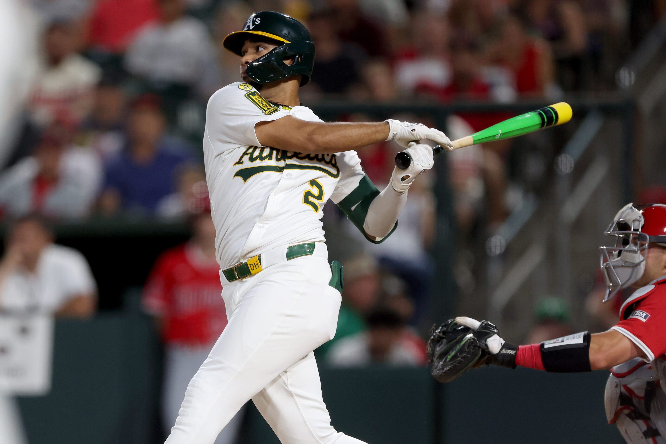 Aug 16, 2025; West Sacramento, California, USA; Athletics shortstop Darell Hernaiz (2) hits a two-run single against the Los Angeles Angels during the third inning at Sutter Health Park. Mandatory Credit: Dennis Lee-Imagn Images