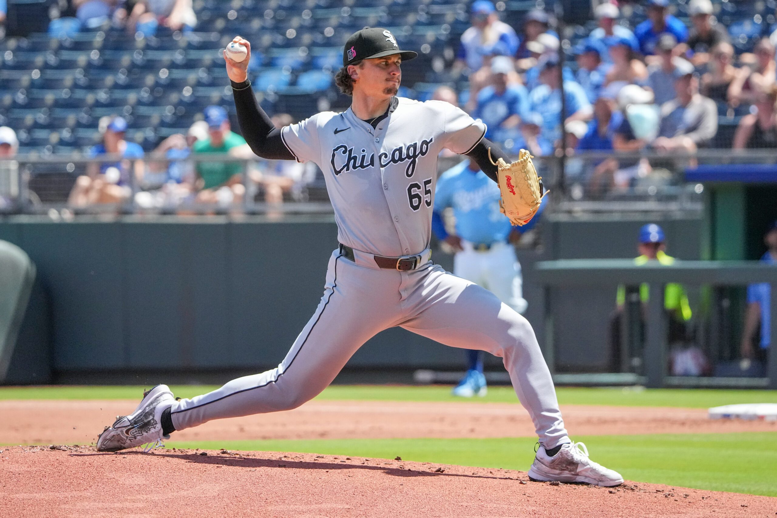 Aug 17, 2025; Kansas City, Missouri, USA; Chicago White Sox starting pitcher Davis Martin (65) delivers a pitch against the Kansas City Royals during the first inning at Kauffman Stadium. Mandatory Credit: Denny Medley-Imagn Images