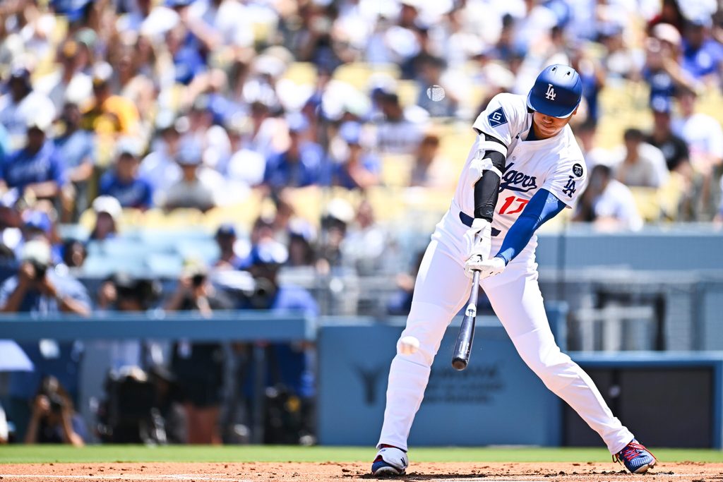 Aug 17, 2025; Los Angeles, California, USA; Los Angeles Dodgers designated hitter Shohei Ohtani (17) hits a single against the San Diego Padres during the first inning at Dodger Stadium. Mandatory Credit: Jonathan Hui-Imagn Images