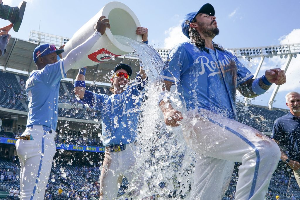Aug 17, 2025; Kansas City, Missouri, USA; Kansas City Royals second baseman Jonathan India (6) is doused by shortstop Bobby Witt Jr. (7) and second baseman Tyler Tolbert (2) after the win over the Chicago White Sox at Kauffman Stadium. Mandatory Credit: Denny Medley-Imagn Images