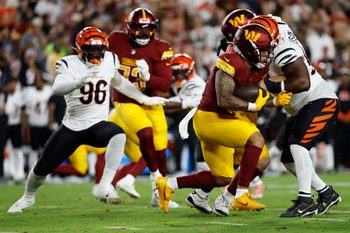 Aug 18, 2025; Landover, Maryland, USA; Washington Commanders running back Chris Rodriguez Jr. (36) carries the ball against the Cincinnati Bengals during the second quarter at Northwest Stadium. Mandatory Credit: Geoff Burke-Imagn Images
