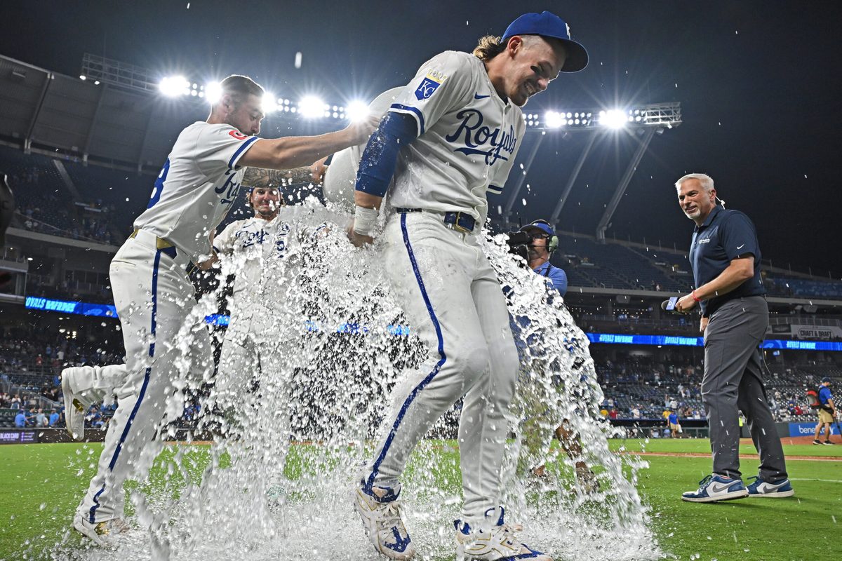 Aug 19, 2025; Kansas City, Missouri, USA; Kansas City Royals teammates ice down shortstop Bobby Witt Jr. (7) after beating the Texas Rangers at Kauffman Stadium. Mandatory Credit: Peter Aiken-Imagn Images