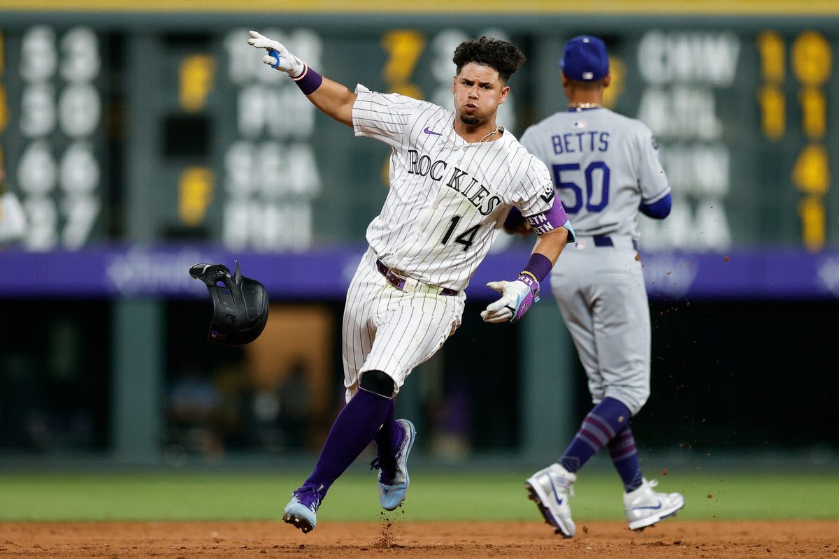 Aug 19, 2025; Denver, Colorado, USA; Colorado Rockies shortstop Ezequiel Tovar (14) rounds the bases on a triple in the eighth inning aLos Angeles Dodgers at Coors Field. Mandatory Credit: Isaiah J. Downing-Imagn Images