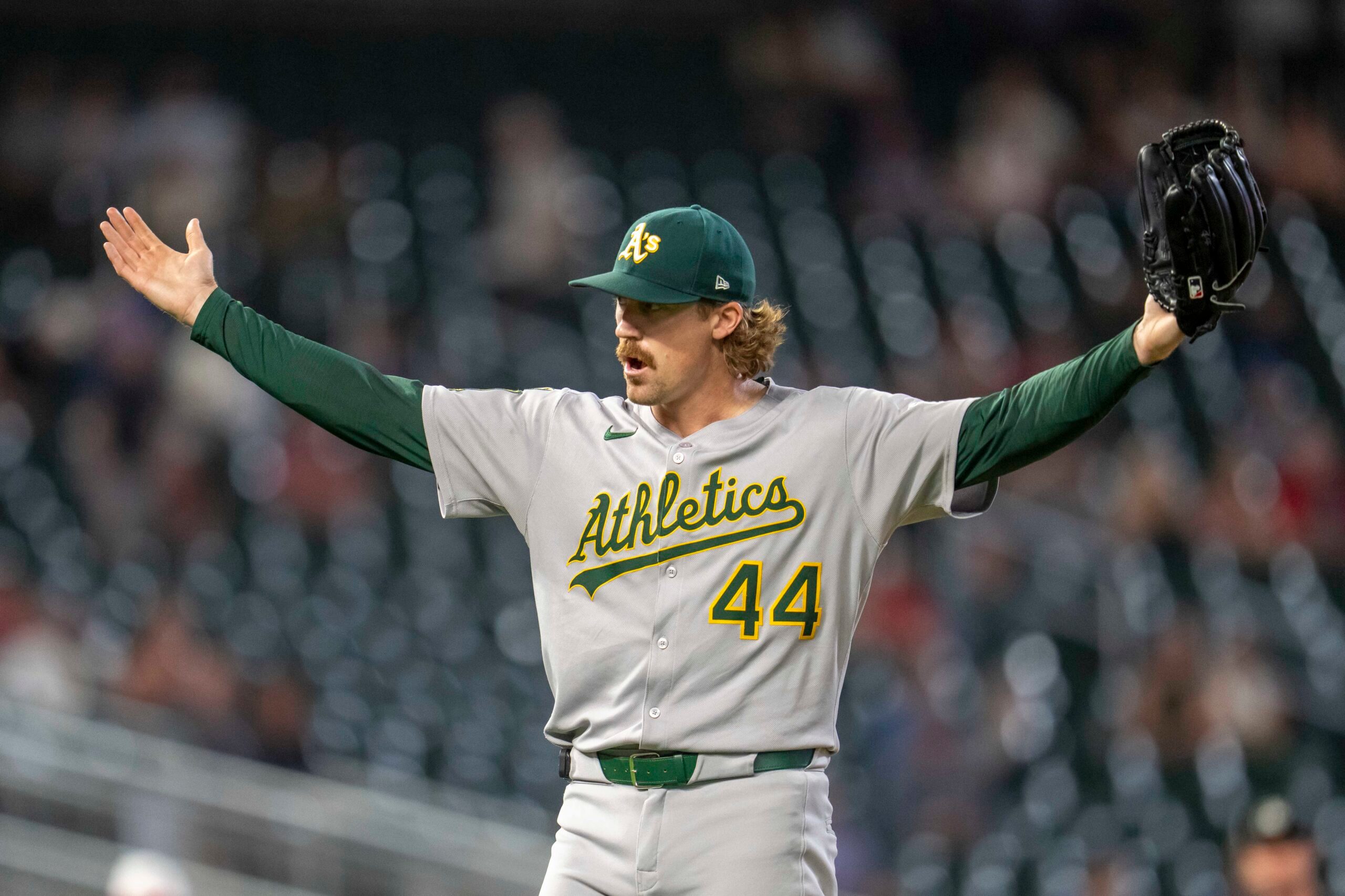 Aug 20, 2025; Minneapolis, Minnesota, USA; Athletics pitcher Tyler Ferguson (44) celebrates after defeating the Minnesota Twins at Target Field. Mandatory Credit: Jesse Johnson-Imagn Images