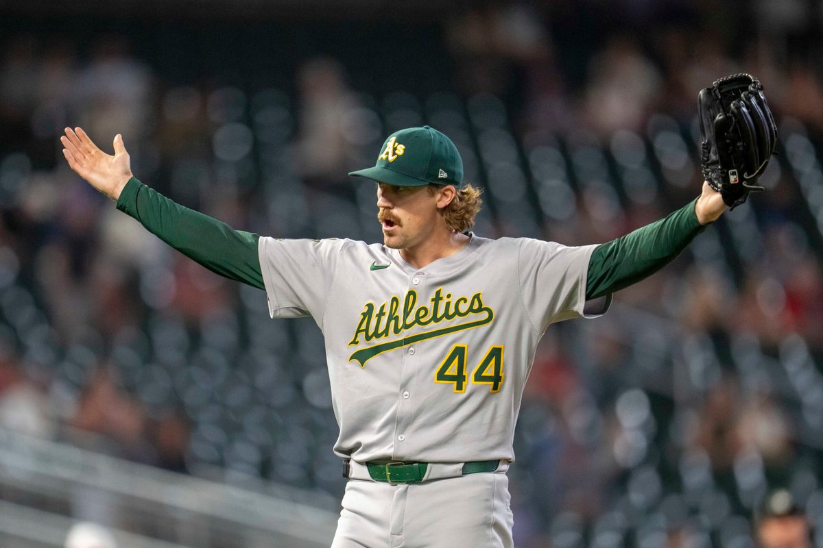 Aug 20, 2025; Minneapolis, Minnesota, USA; Athletics pitcher Tyler Ferguson (44) celebrates after defeating the Minnesota Twins at Target Field. Mandatory Credit: Jesse Johnson-Imagn Images