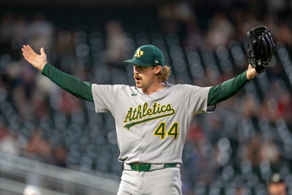 Aug 20, 2025; Minneapolis, Minnesota, USA; Athletics pitcher Tyler Ferguson (44) celebrates after defeating the Minnesota Twins at Target Field. Mandatory Credit: Jesse Johnson-Imagn Images