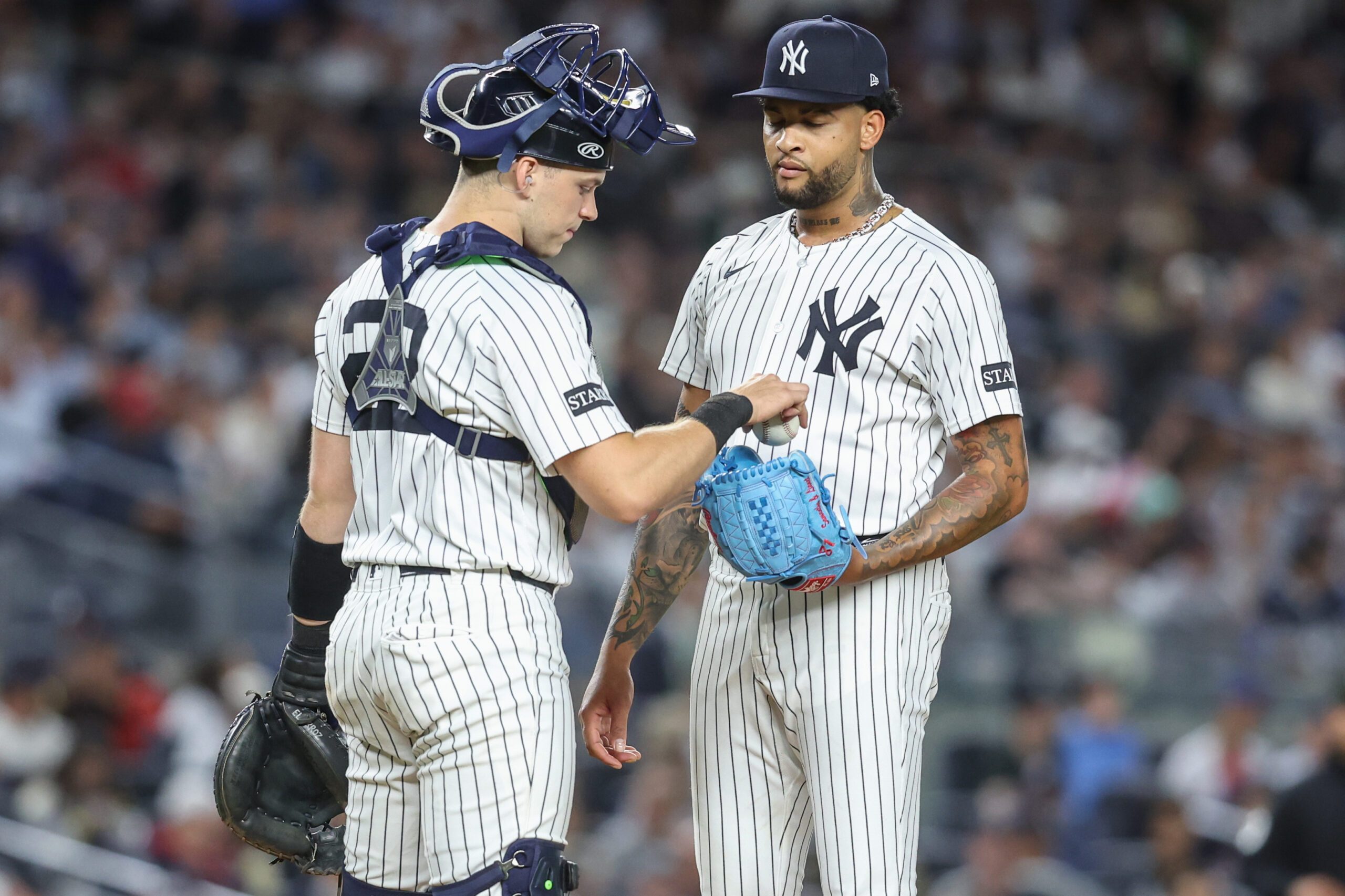 Aug 21, 2025; Bronx, New York, USA;  New York Yankees starting pitcher Luis Gil (81) talks with catcher Ben Rice (22) after loading the bases in the fifth inning against the Boston Red Sox at Yankee Stadium. Mandatory Credit: Wendell Cruz-Imagn Images