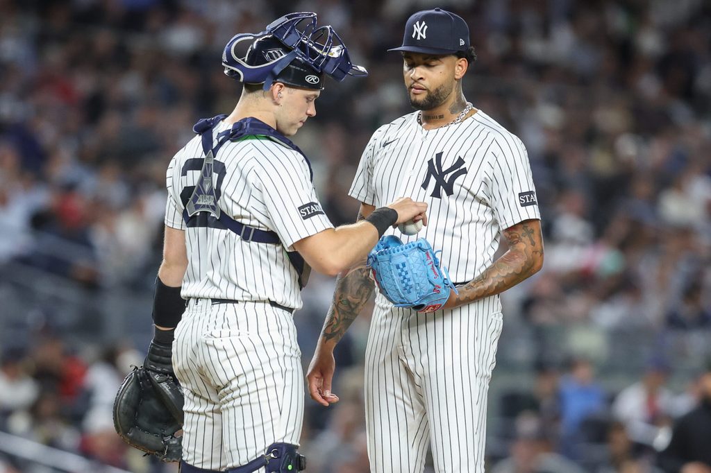 Aug 21, 2025; Bronx, New York, USA; New York Yankees starting pitcher Luis Gil (81) talks with catcher Ben Rice (22) after loading the bases in the fifth inning against the Boston Red Sox at Yankee Stadium. Mandatory Credit: Wendell Cruz-Imagn Images