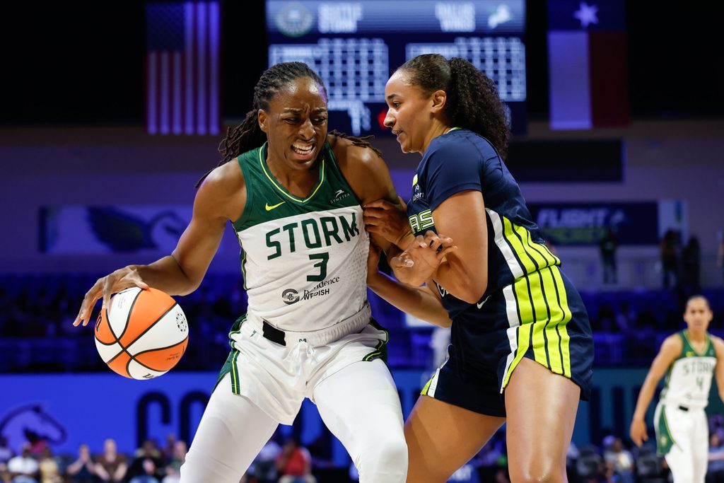 Aug 22, 2025; Arlington, Texas, USA; Seattle Storm forward Nneka Ogwumike (3) contols the ball as Dallas Wings guard Haley Jones (30) defends during the first half at College Park Center. Mandatory Credit: Chris Jones-Imagn Images