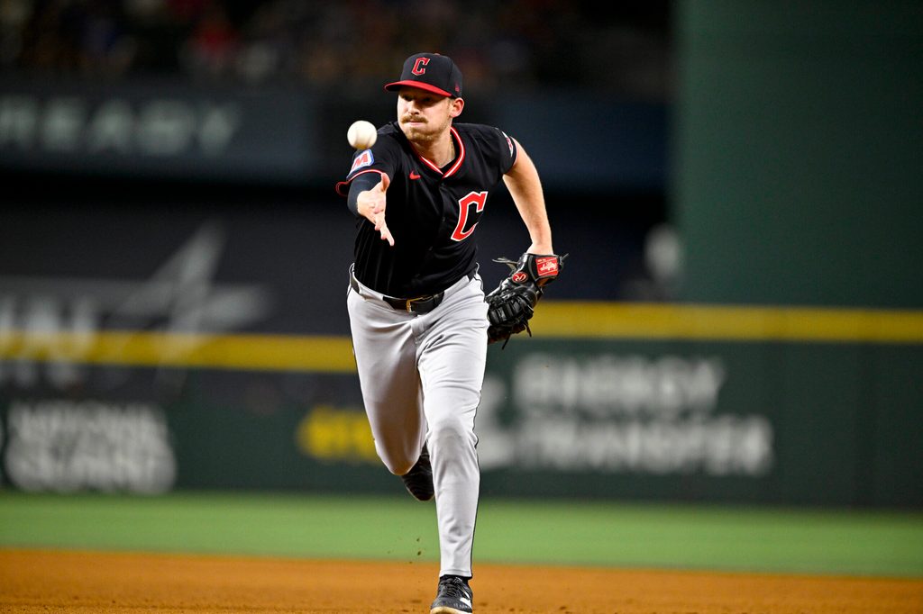 Aug 23, 2025; Arlington, Texas, USA; Cleveland Guardians first baseman Kyle Manzardo (9) tosses the ball to first base during the game against the Texas Rangers at Globe Life Field. Mandatory Credit: Jerome Miron-Imagn Images