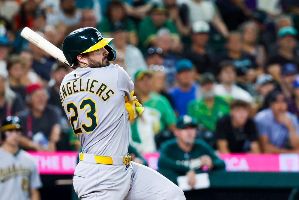Aug 23, 2025; Seattle, Washington, USA; Athletics catcher Shea Langeliers (23) hits an RBI-double against the Seattle Mariners during the tenth inning at T-Mobile Park. Mandatory Credit: Joe Nicholson-Imagn Images