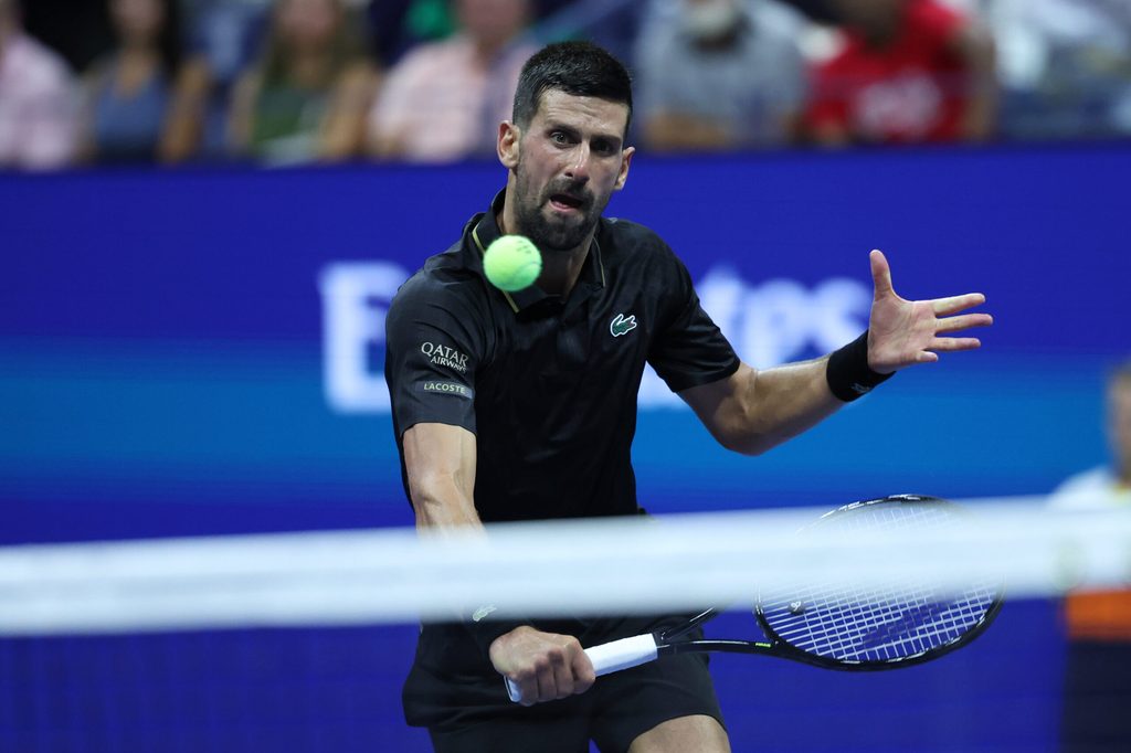 Aug 24, 2025; Flushing, NY, USA; Novak Djokovic (SRB) hits the ball against Learner Tien (USA) (not pictured) on day one of the 2025 U.S. Open tennis tournament at USTA Billie Jean King National Tennis Center. Mandatory Credit: Amber Searls-Imagn Images