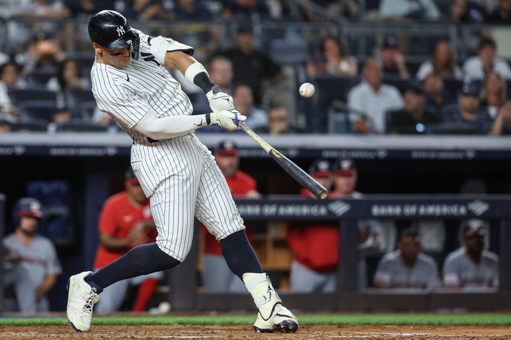 Aug 25, 2025; Bronx, New York, USA; New York Yankees designated hitter Aaron Judge (99) hits an RBI double in the fifth inning against the Washington Nationals at Yankee Stadium. Mandatory Credit: Wendell Cruz-Imagn Images