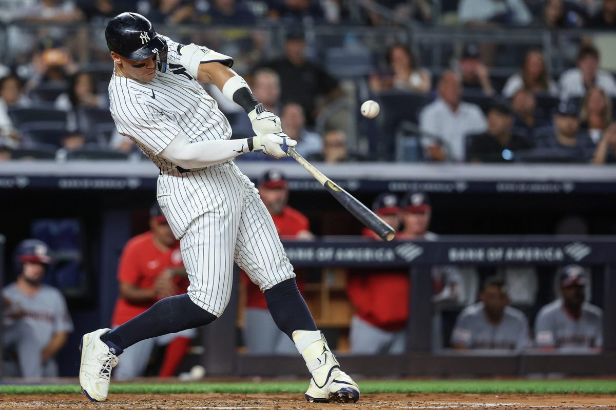 Aug 25, 2025; Bronx, New York, USA; New York Yankees designated hitter Aaron Judge (99) hits an RBI double in the fifth inning against the Washington Nationals at Yankee Stadium. Mandatory Credit: Wendell Cruz-Imagn Images