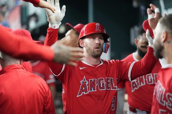 Aug 25, 2025; Arlington, Texas, USA; Los Angeles Angels designated hitter Logan O'Hoppe (14) celebrates his solo home run with teammates in the dugout against the Texas Rangers during the ninth inning at Globe Life Field. Mandatory Credit: Jim Cowsert-Imagn Images