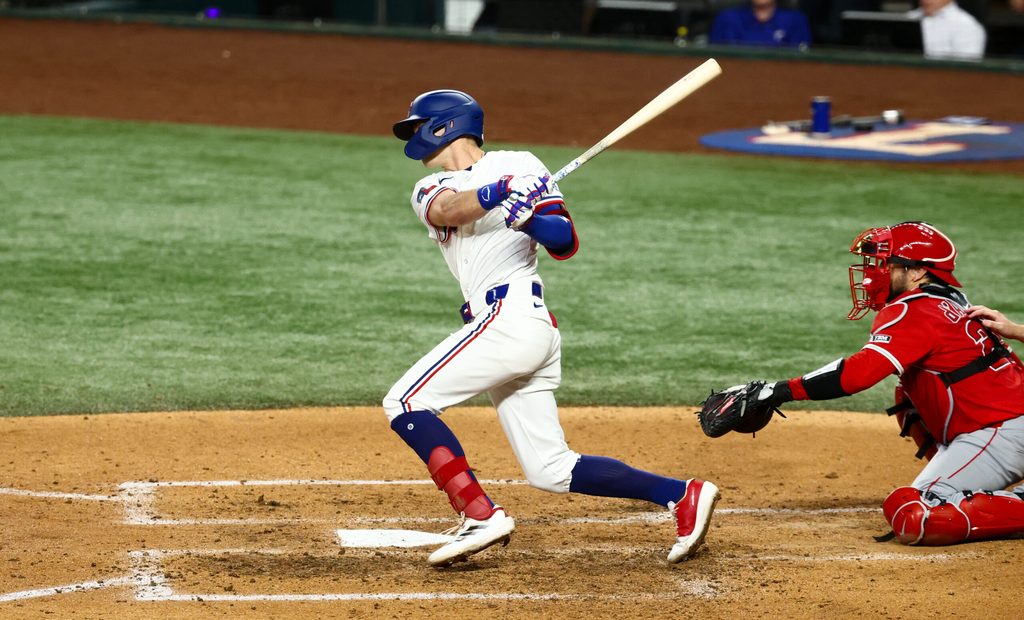 Aug 26, 2025; Arlington, Texas, USA; Texas Rangers center fielder Michael Helman (24) bats during the sixth inning against the Los Angeles Angels at Globe Life Field. Mandatory Credit: Kevin Jairaj-Imagn Images