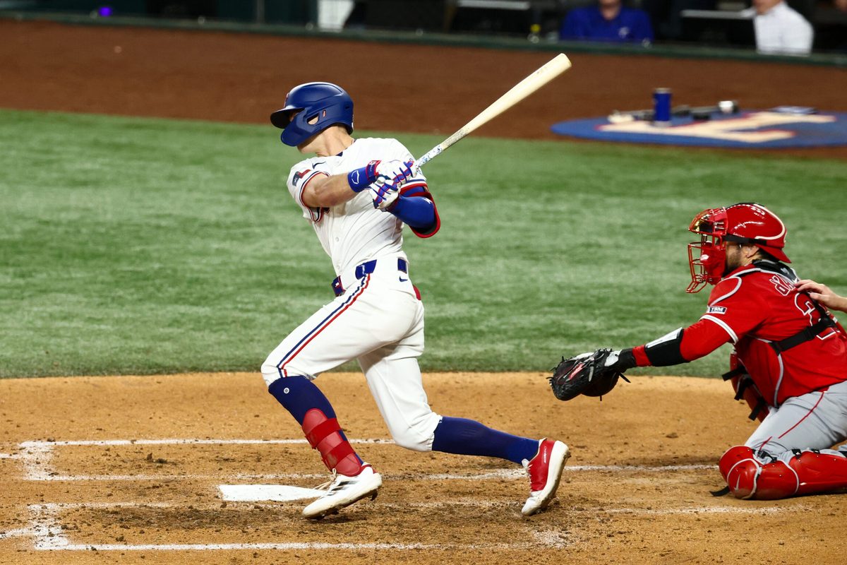 Aug 26, 2025; Arlington, Texas, USA; Texas Rangers center fielder Michael Helman (24) bats during the sixth inning against the Los Angeles Angels at Globe Life Field. Mandatory Credit: Kevin Jairaj-Imagn Images