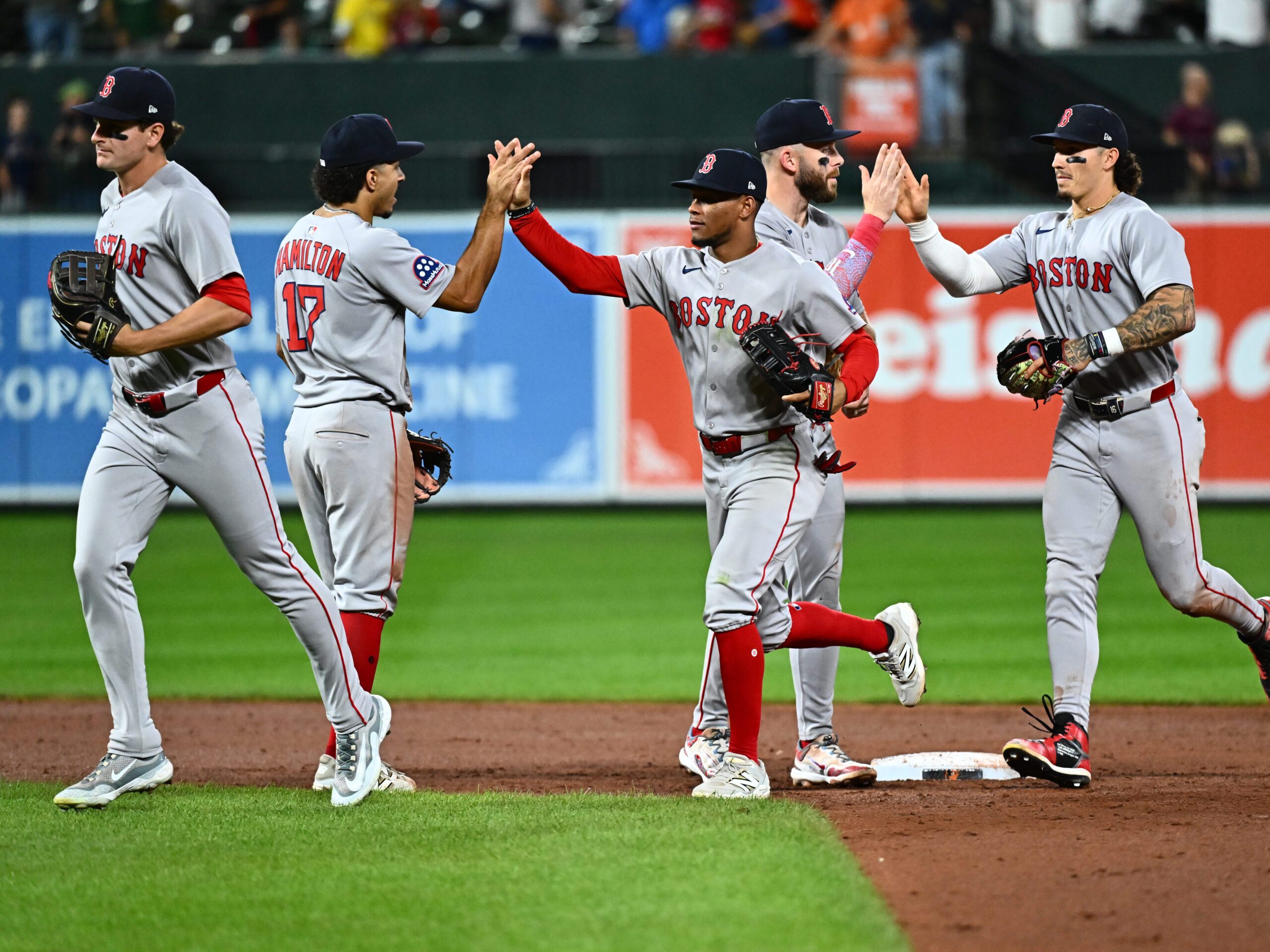 Aug 27, 2025; Baltimore, Maryland, USA;  Boston Red Sox players celebrate the win against the Baltimore Orioles at Oriole Park at Camden Yards. Mandatory Credit: James A. Pittman-Imagn Images