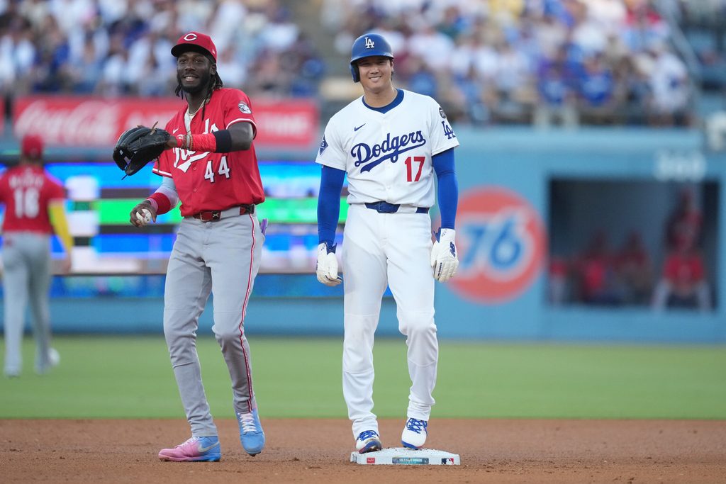 Aug 27, 2025; Los Angeles, California, USA; Los Angeles Dodgers starting pitcher Shohei Ohtani (17) is held at second base by Cincinnati Reds shortstop Elly De La Cruz (44) in the fourth inning at Dodger Stadium. Mandatory Credit: Kirby Lee-Imagn Images