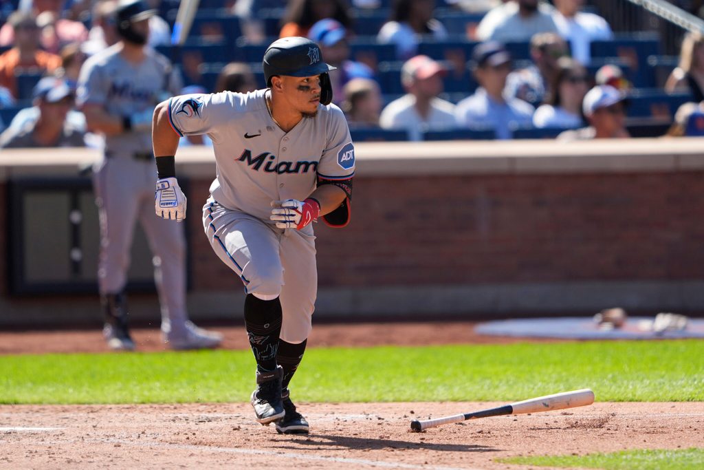 Aug 31, 2025; New York City, New York, USA; Miami Marlins left fielder Heriberto Hernandez (64) runs out a single against the New York Mets during the sixth inning at Citi Field. Mandatory Credit: Gregory Fisher-Imagn Images