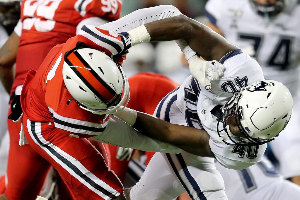 Cincinnati Bearcats cornerback Arquon Bush (9) and Connecticut Huskies tight end Jayce Medlock (40) entangle in the fourth quarter of a college football game, Saturday, Nov. 9, 2019, at Nippert Stadium in Cincinnati.
Connecticut Huskies At Cincinnati Bearcats Nov 9