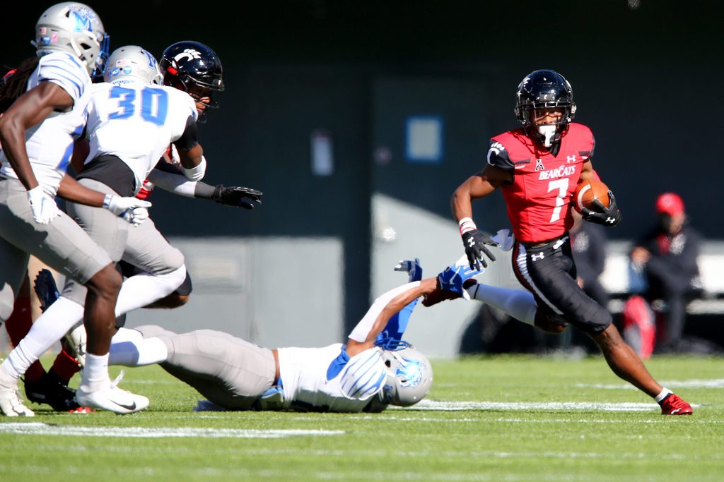 Cincinnati Bearcats wide receiver Tre Tucker (7) runs downfield after catching a pass during the first quarter of a college football game against the Memphis Tigers, Saturday, Oct. 31, 2020, at Nippert Stadium in Cincinnati. The Cincinnati Bearcats lead 21-10.
Memphis Tigers At Cincinnati Bearcats Oct 31