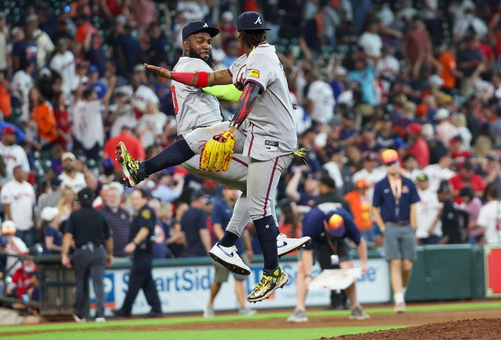 Apr 17, 2024; Houston, Texas, USA;Atlanta Braves designated hitter Marcell Ozuna (20) and right fielder Ronald Acuna Jr. (13) celebrate the win against the Houston Astros Minute Maid Park. Mandatory Credit: Thomas Shea-Imagn Images
