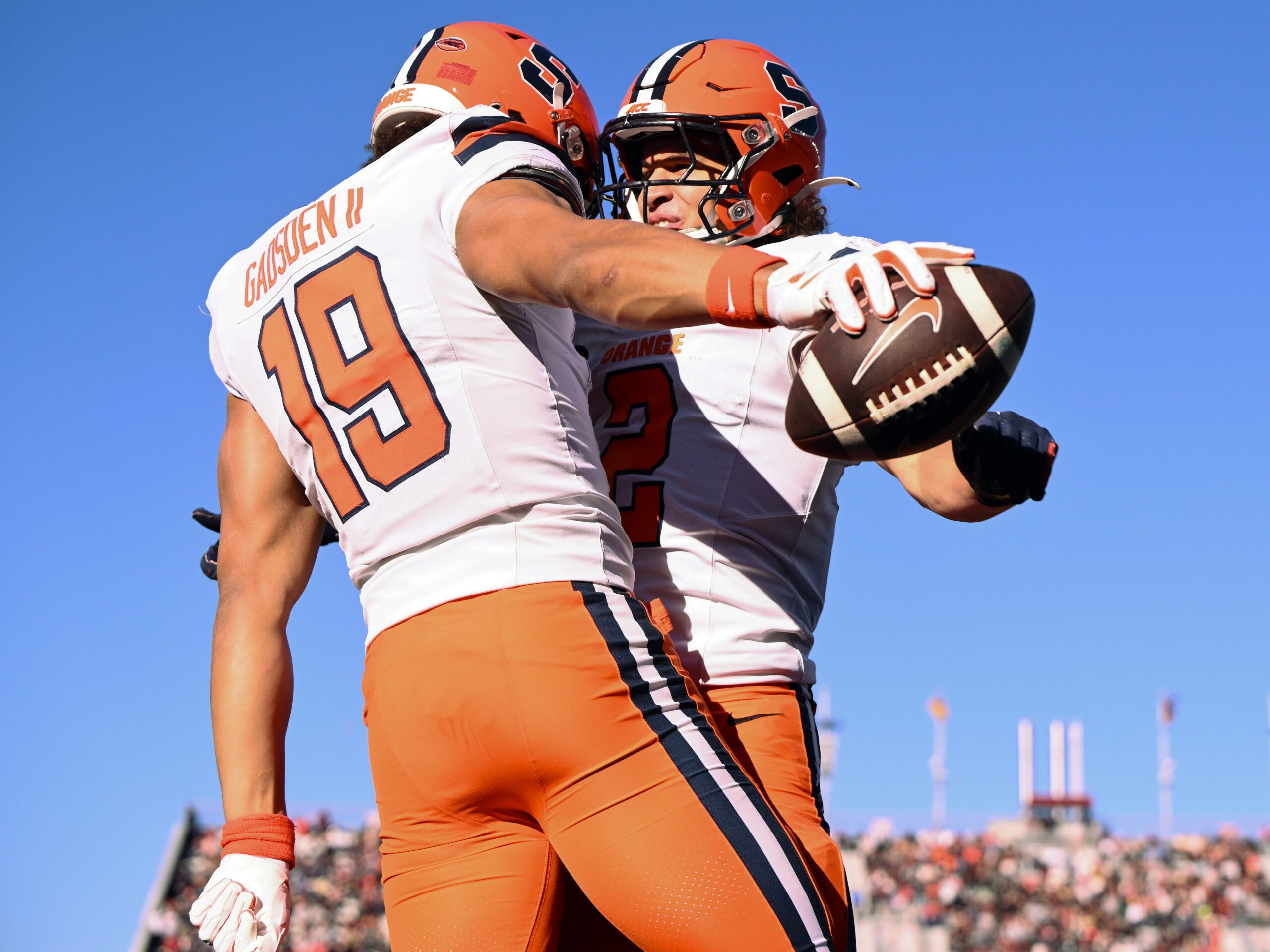 Nov 9, 2024; Chestnut Hill, Massachusetts, USA; Syracuse Orange tight end Oronde Gadsden II (19) celebrates with wide receiver Trebor Pena (2) after scoring a touchdown against the Boston College Eagles during the first half at Alumni Stadium. Mandatory Credit: Brian Fluharty-Imagn Images