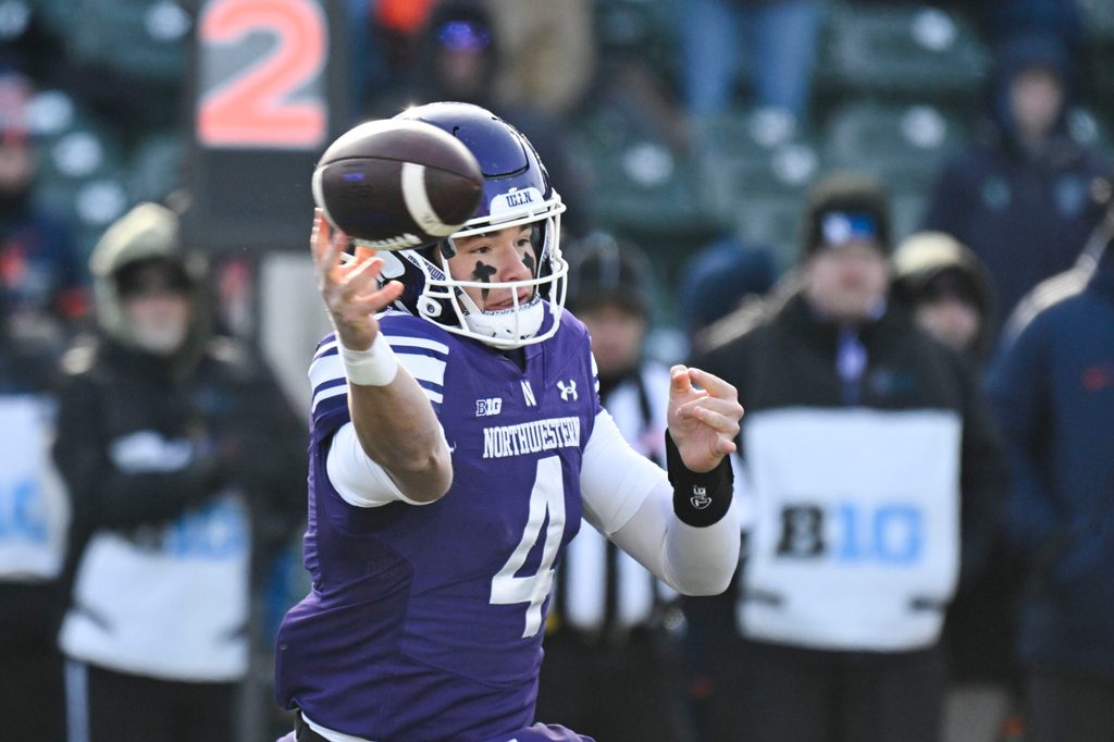 Nov 30, 2024; Chicago, Illinois, USA; Northwestern Wildcats quarterback Ryan Boe (4) passes the ball against Illinois Fighting Illini during the first half at Wrigley Field. Mandatory Credit: Matt Marton-Imagn Images