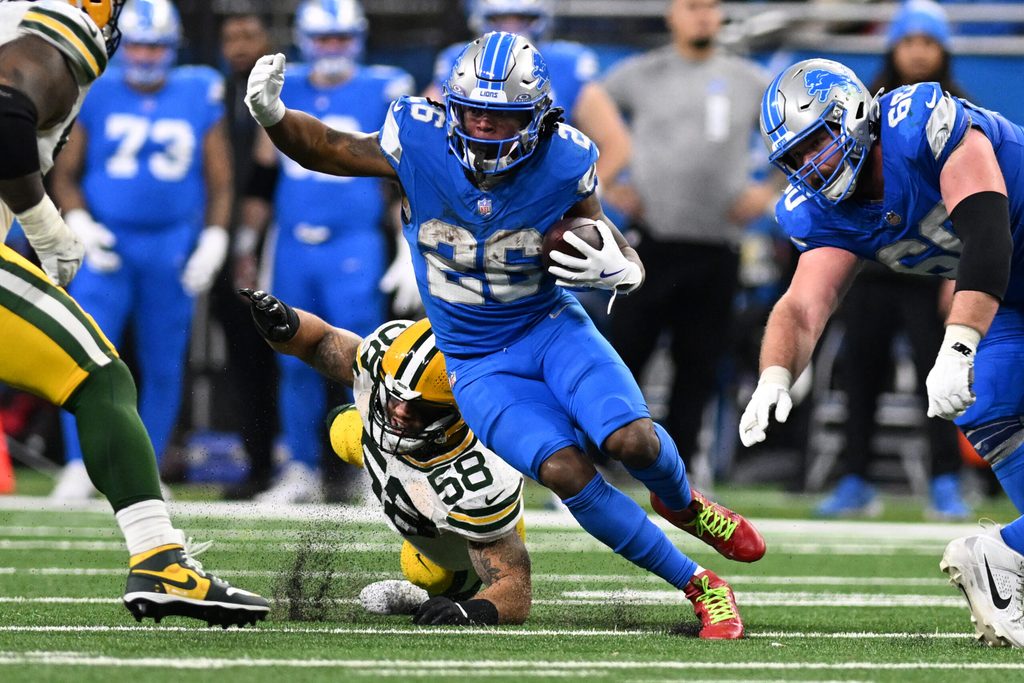 Dec 5, 2024; Detroit, Michigan, USA; Detroit Lions running back Jahmyr Gibbs (26) runs the ball upfield against the Green Bay Packers in the fourth quarter at Ford Field. Mandatory Credit: Lon Horwedel-Imagn Images