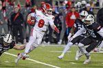 Western Kentucky's Easton Messer tries to evade the tackle of Jacksonville State's Walker O'Steen during the C-USA Championship at AmFirst Stadium in Jacksonville, Alabama , Alabama December 6, 2024. (Dave Hyatt / Hyatt Media LLC)