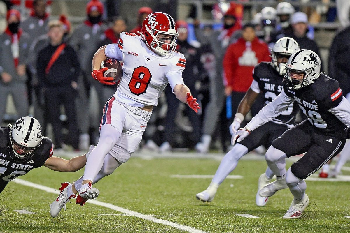 Western Kentucky's Easton Messer tries to evade the tackle of Jacksonville State's Walker O'Steen during the C-USA Championship at AmFirst Stadium in Jacksonville, Alabama , Alabama December 6, 2024. (Dave Hyatt / Hyatt Media LLC)