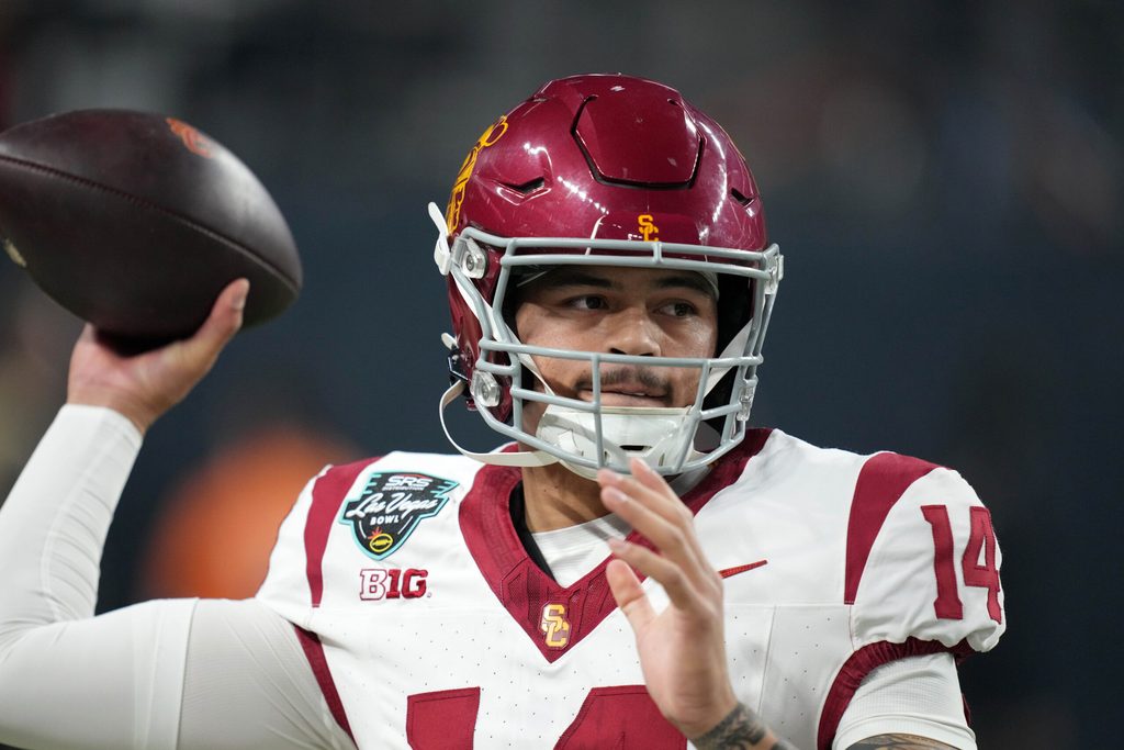 Dec 27, 2024; Las Vegas, NV, USA; Southern California Trojans quarterback Jayden Maiava (14) throws the ball against the Texas A&M Aggies in the first half at Allegiant Stadium. Mandatory Credit: Kirby Lee-Imagn Images