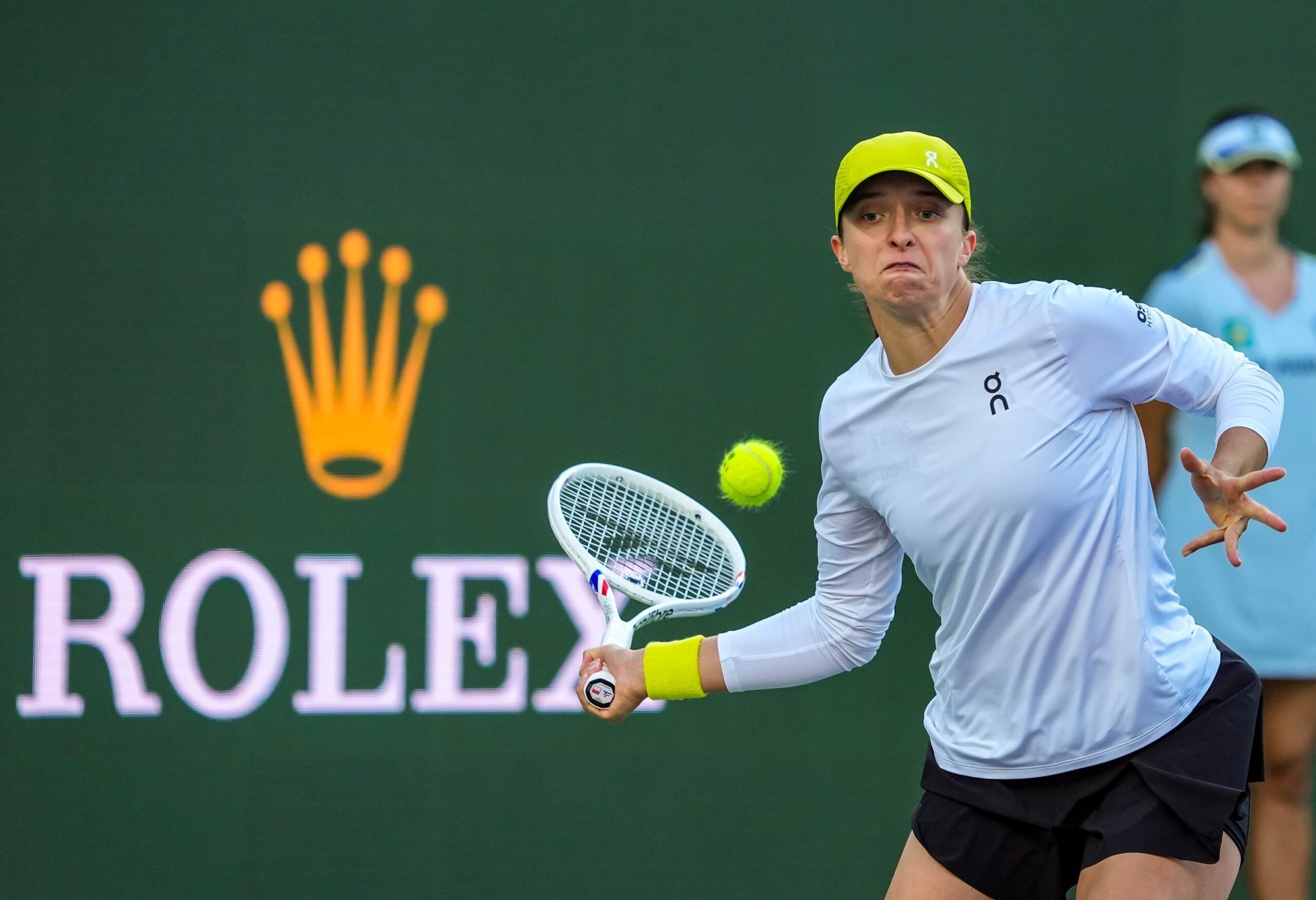 Iga Swiatek hits to Mirra Andreeva during the WTA semifinals at the BNP Paribas Open in Indian Wells, Calif., Friday, March 14, 2025.