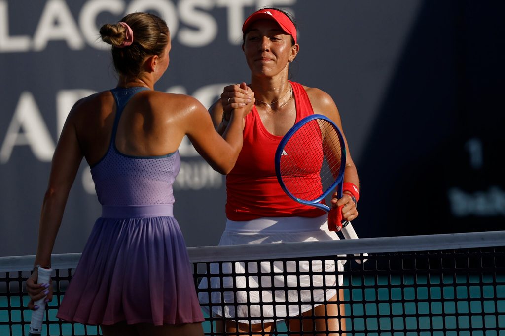 Mar 24, 2025; Miami, FL, USA; Jessica Pegula (USA)(R) shakes hands with Marta Kostyuk (UKR)(L) at the net after their match on day seven of the Miami Open at Hard Rock Stadium. Mandatory Credit: Geoff Burke-Imagn Images