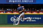 Aug 10, 2025; Seattle, Washington, USA; Tampa Bay Rays second baseman Brandon Lowe (8) throws to first base against the Seattle Mariners during the seventh inning at T-Mobile Park. Mandatory Credit: Joe Nicholson-Imagn Images